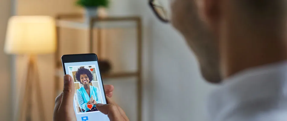 Two people interacting on a phone video call